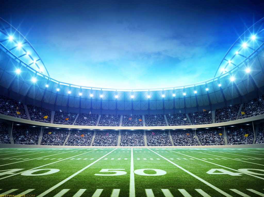 Inside SoFi stadium at 50 yard line with lights on