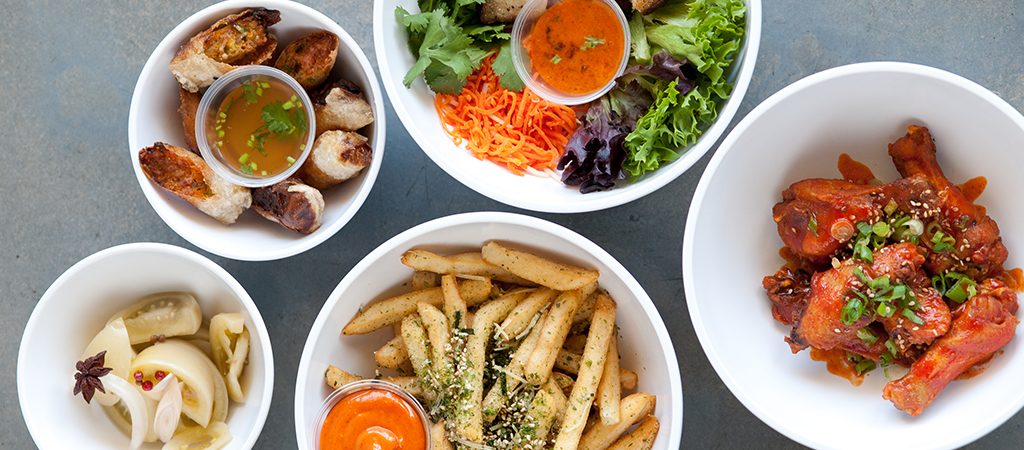 Looking down at bowls of vegetarian food options available in Torrance