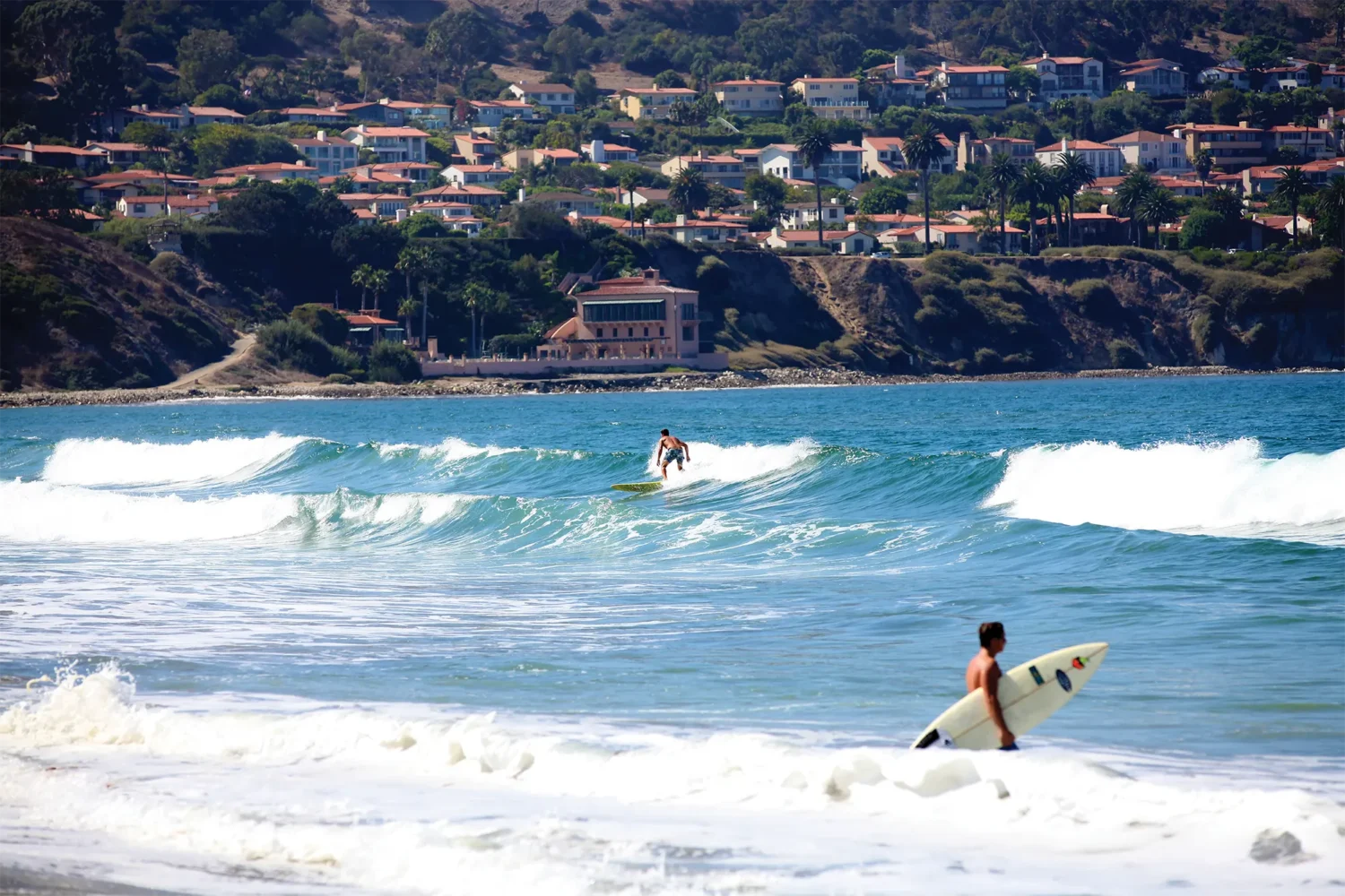 Surfing Torrance Beach with view of Palos Verdes