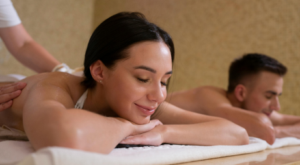 Couple getting massage at wellness spa