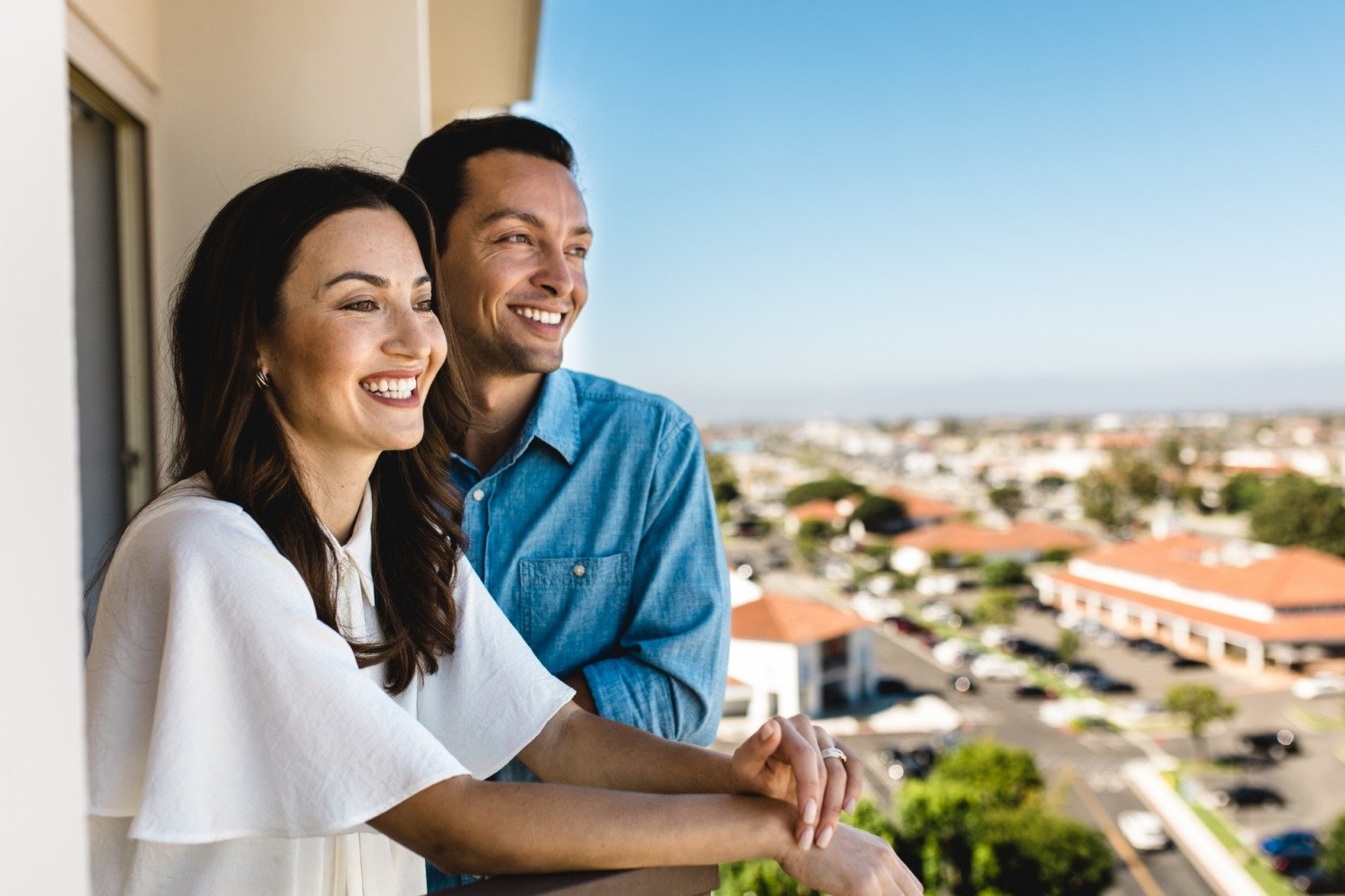 Couple overlooking the scenic view from their balcony at the DoubleTree hotel in Torrance