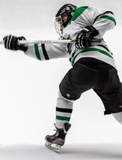 Hockey player taking a shot on the ice