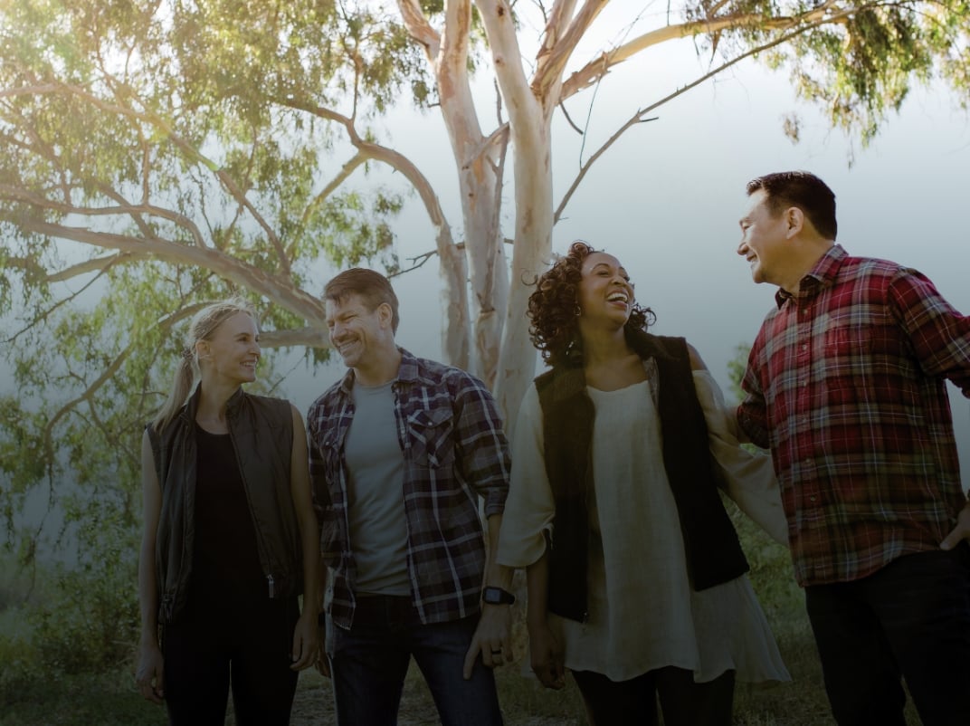 Group of four adults walking in Madrona Marsh Nature Center and Preserve