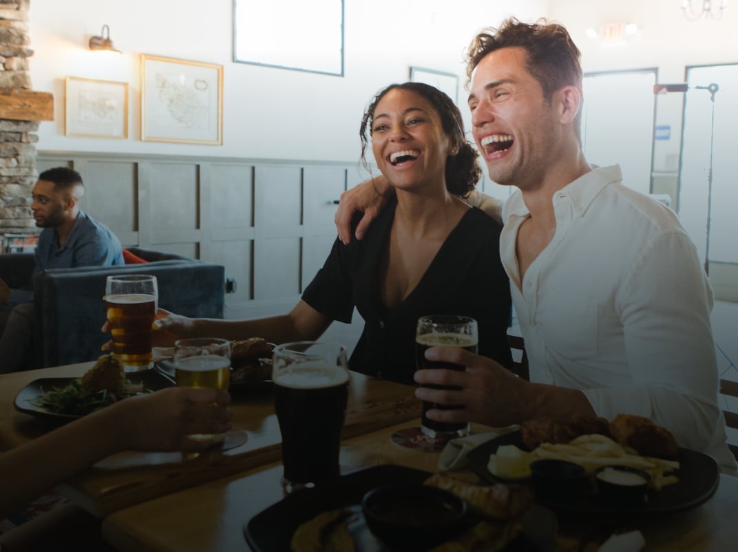 Couple enjoying beer at a brewery