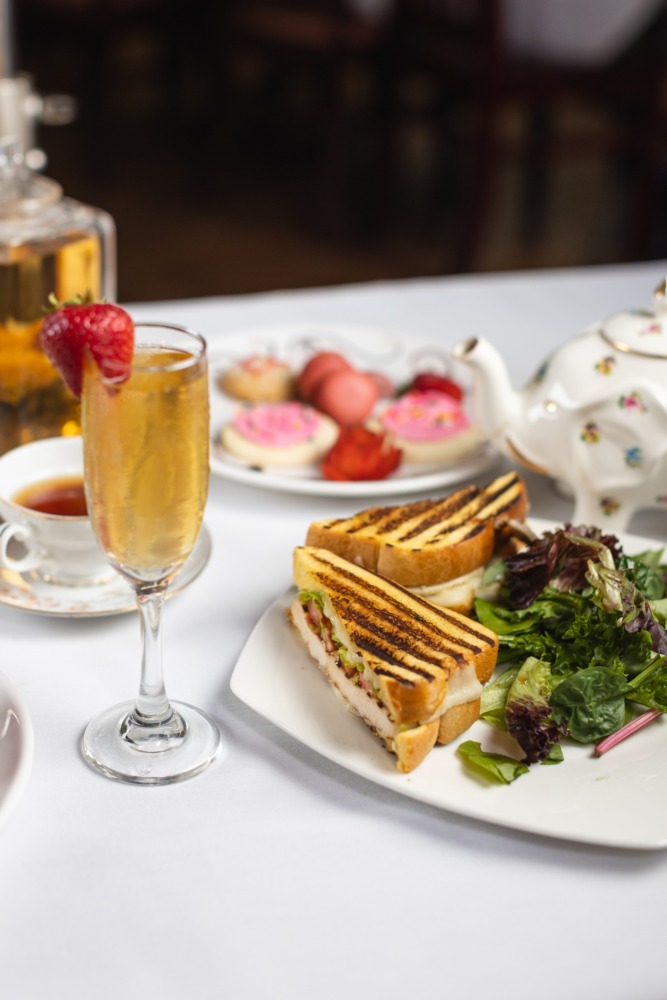 Sandwich and greens plate with sparkling beverage at Chado Tea Room