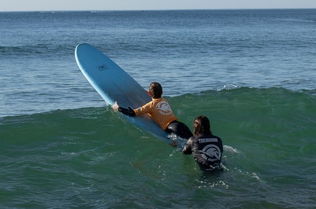 Surfers riding waves in the ocean