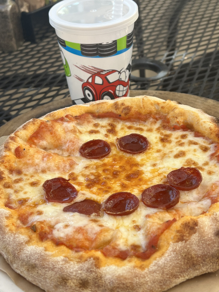 Red Car Brewery kids pizza with a drink