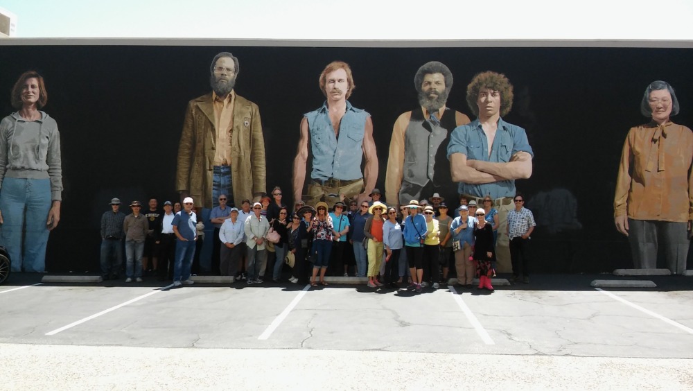 walking tour in front of mural